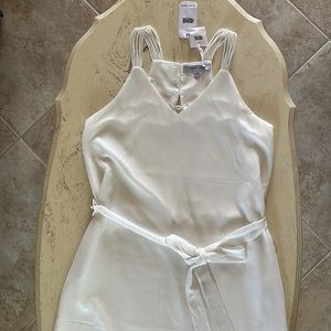 White Dress by Naked Zebra.  Beautiful flowing fabric that lays nicely! NWT